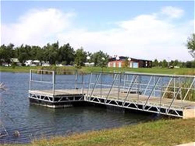 A dock with a boat moored